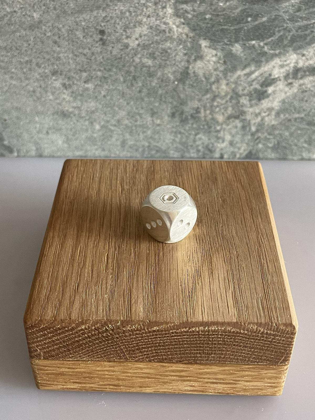 Silver Dice on oak case