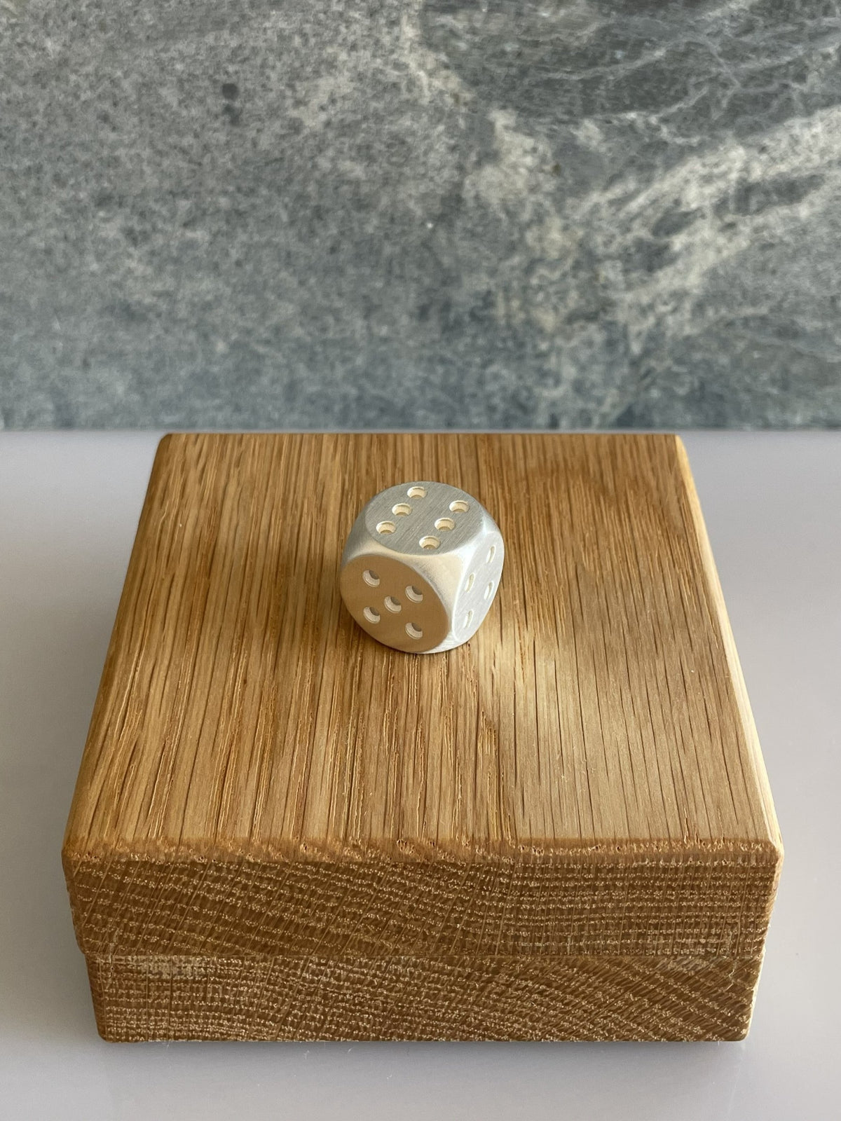 Dice Silver 6mm brushed on oak case no6