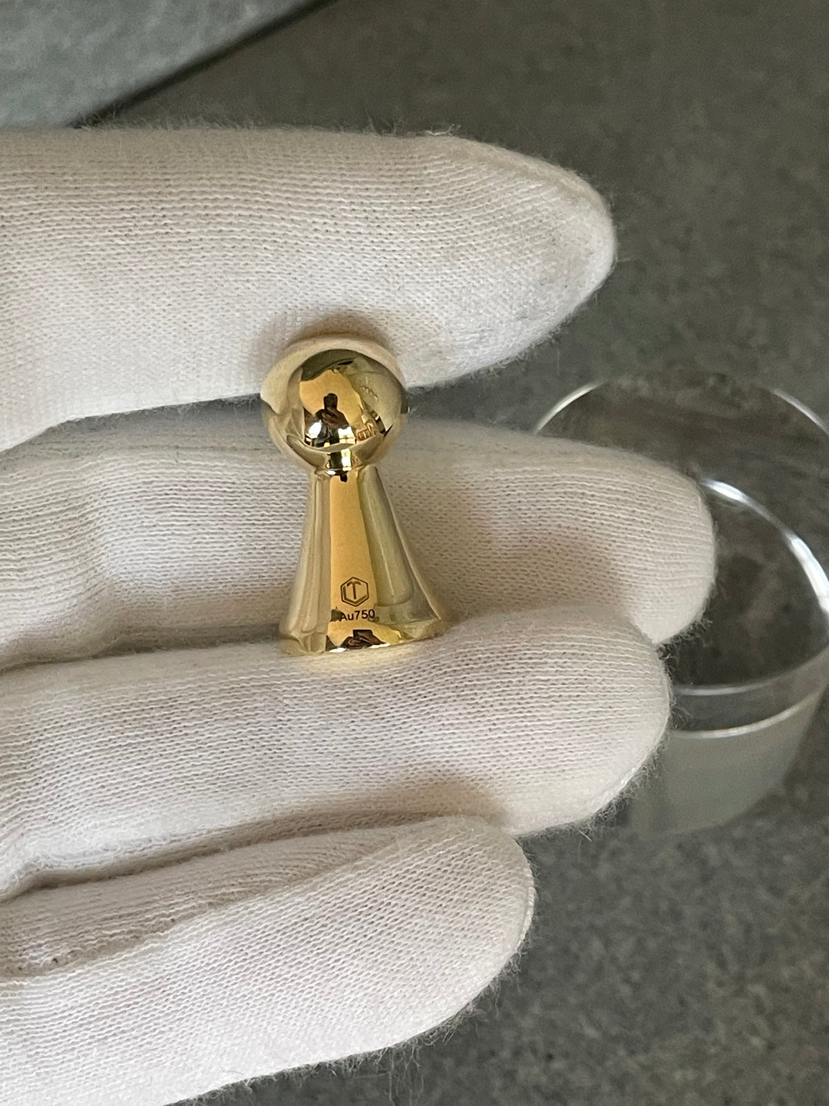18k gold game piece