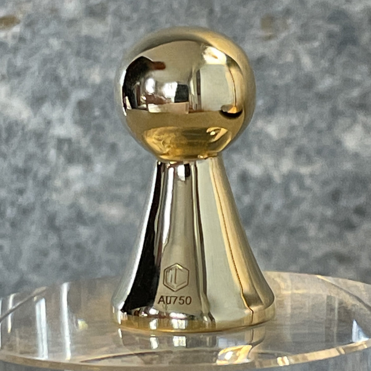 18k gold game piece