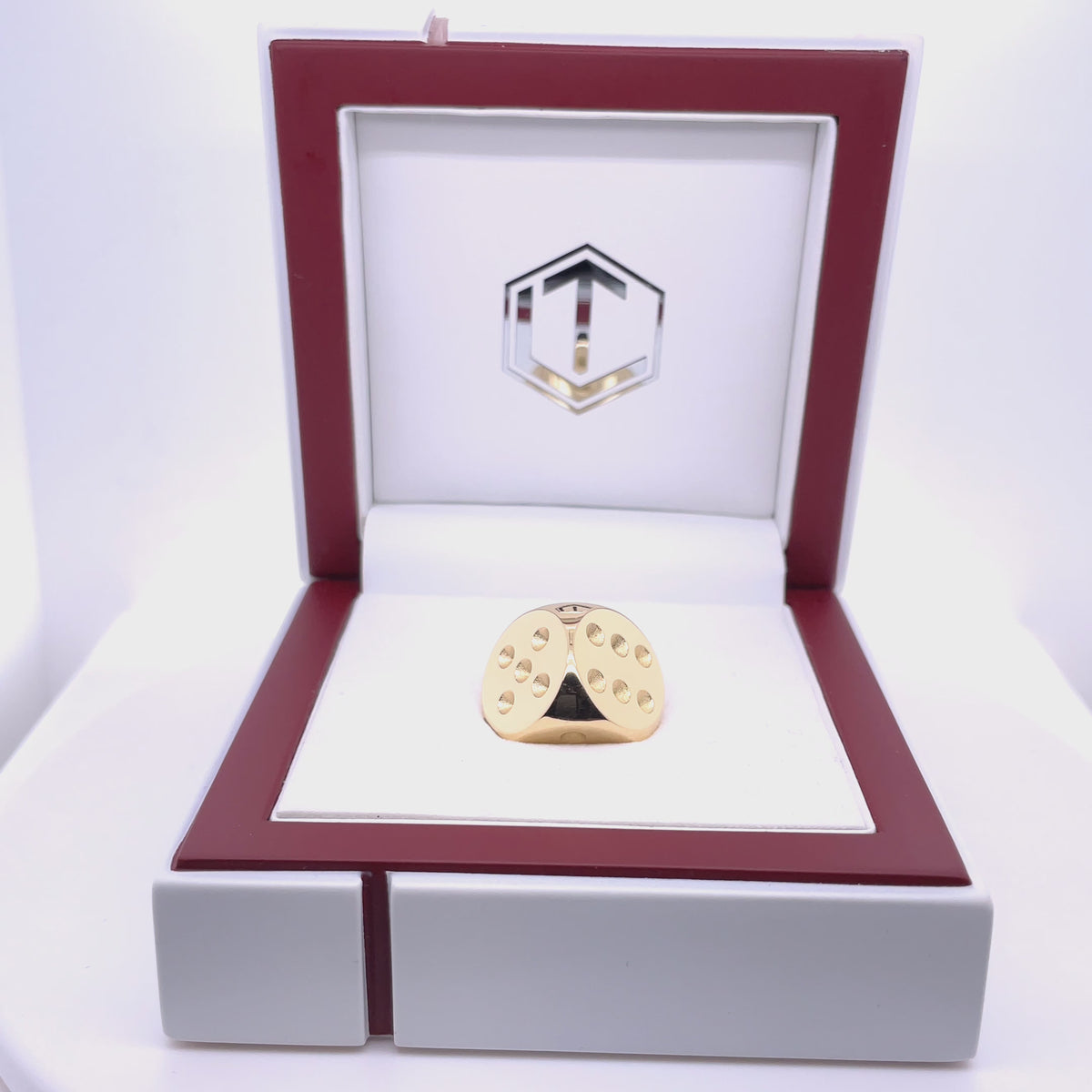 Gold Dice presented in white case