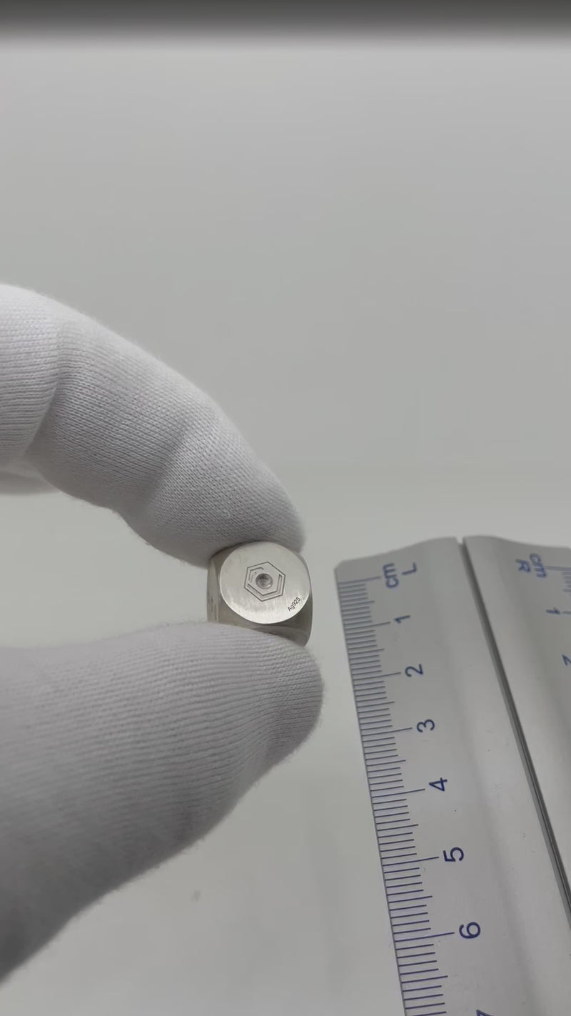 Dice Silver 14mm presented in hand