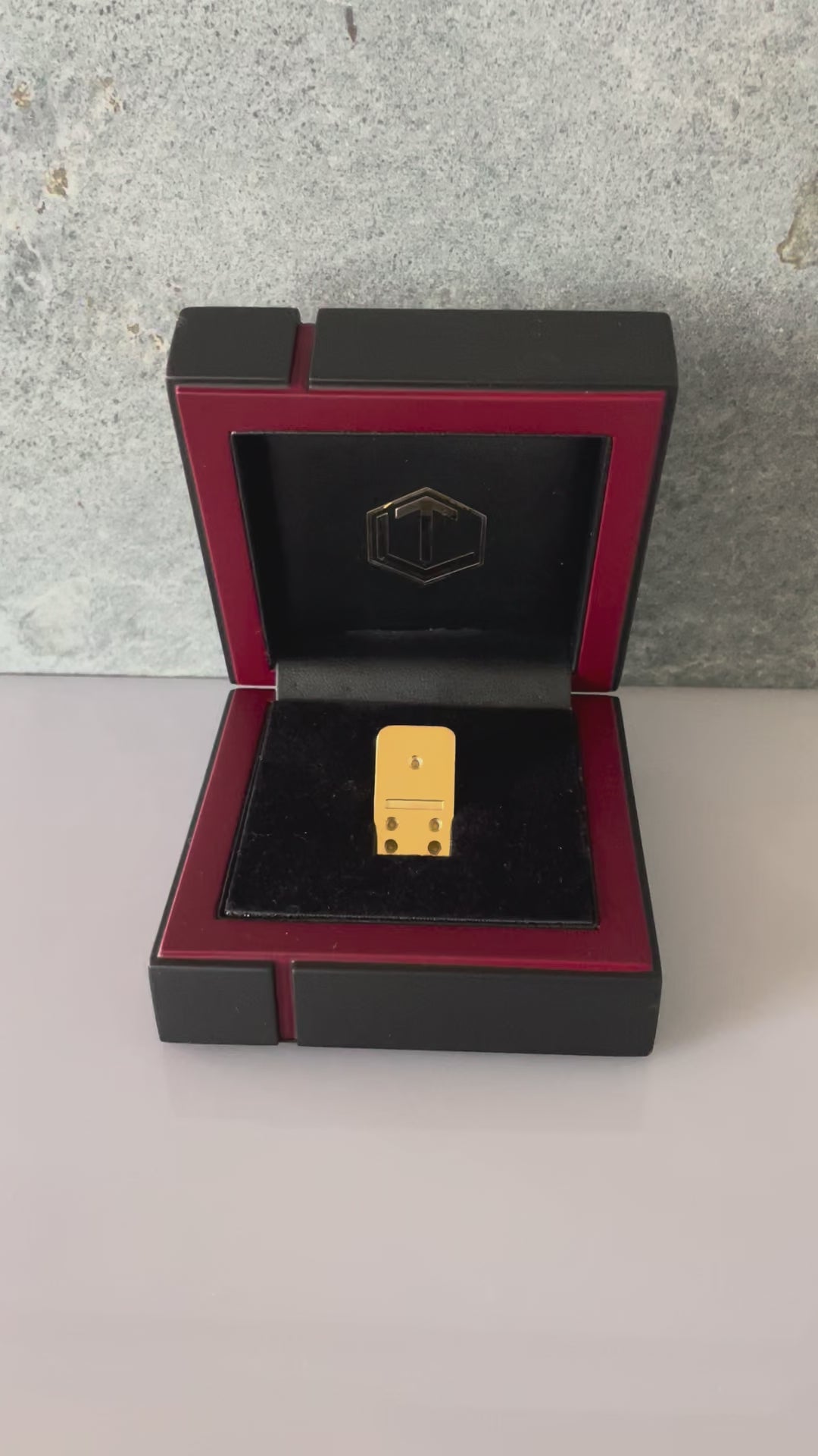 Domino tile made of 18k gold in black case video presented in case.