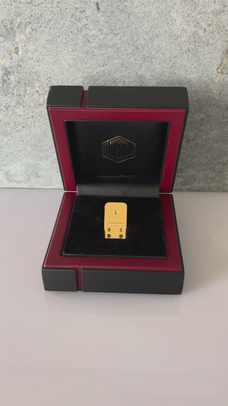 Domino tile made of 18k gold in black case video presented in case.